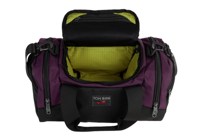 visible variant TB0904-UKWD^^The Night Flight Travel Duffel in Aubergine Ballistic with a Wasabi 200 Halcyon interior.