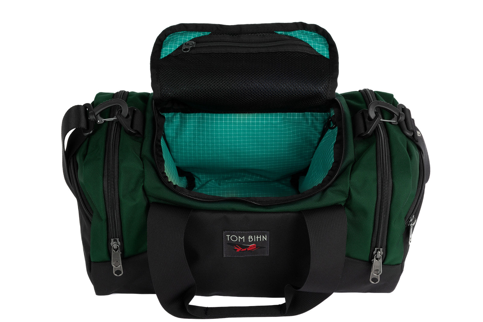 visible variant TB0904-WKED^^The Night Flight Travel Duffel in Wilderness Ballistic with a Kelpie 200 Halcyon interior.