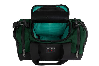 visible variant TB0904-WKED^^The Night Flight Travel Duffel in Wilderness Ballistic with a Kelpie 200 Halcyon interior.