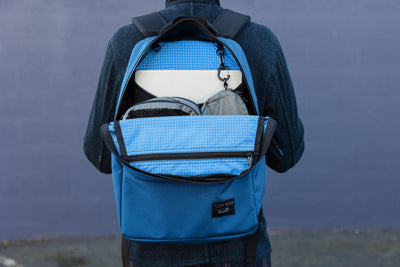 The Paragon 2.0 open showing the interior zippered pocket and laptop compartment.