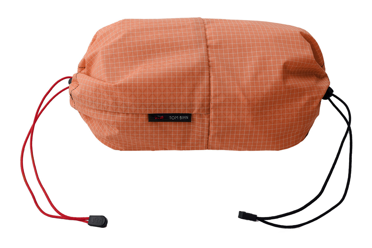 visible variant TB09375-3D^^An Aeronaut 30 Travel Laundry Stuff Sack in Honeydew (pale orange with white grid) 200 Halcyon.