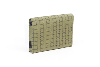 visible variant TB1275-VH^^The Size 5 Nik's Minimalist Wallet in Taiga (olive green with grey grid) 400 Halcyon closed with the attached elastic band.