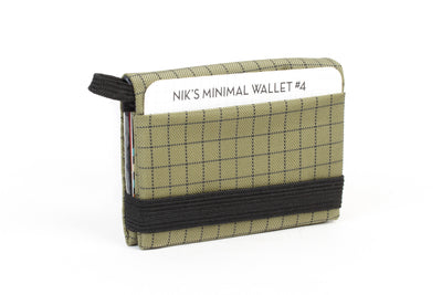 visible variant TB1280-VH^^The Size 4 Nik's Minimalist Wallet in Taiga (olive green with grey grid) 400 Halcyon closed with the attached elastic band.