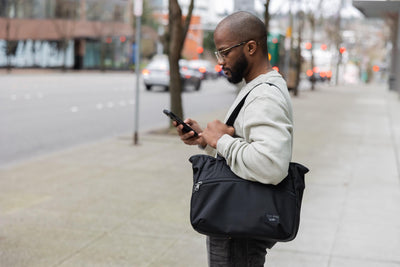visible lifestyle^^A person carrying a Nomad Tote over their shoulder.
