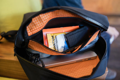 visible lifestyle^^ Interior of the Paragon 2.0 with items in the top pocket.