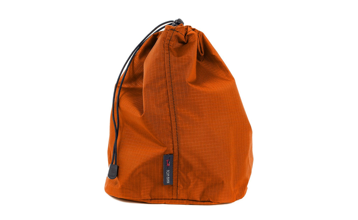 visible variant TB1254-PL^^A Size 4 Persimmon (dark orange with orange grid) 210 Cerylon Travel Stuff Sack.