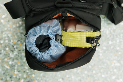visible lifestyle^^A 3D Clear Organizer Cube and Travel Stuff Sack in the side pocket of the Night Flight Travel Duffel.
