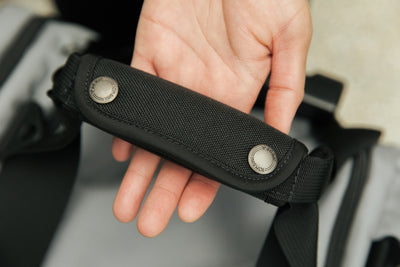 visible detail^^A close up of the grab handle of a Night Flight Travel Duffel