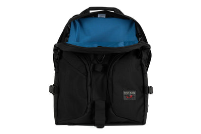 visible variant TB0114-BKOL^^The Brain Bag in Black Ballistic with the front main compartment zipper opened to reveal its Cobalt (blue with light blue grid) 210 Cerylon interior.
