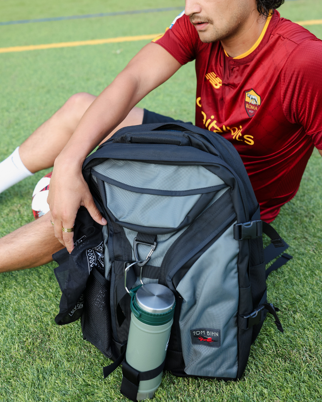 lifestyle visible^^A person reaching into mesh pocket to grab bandana.