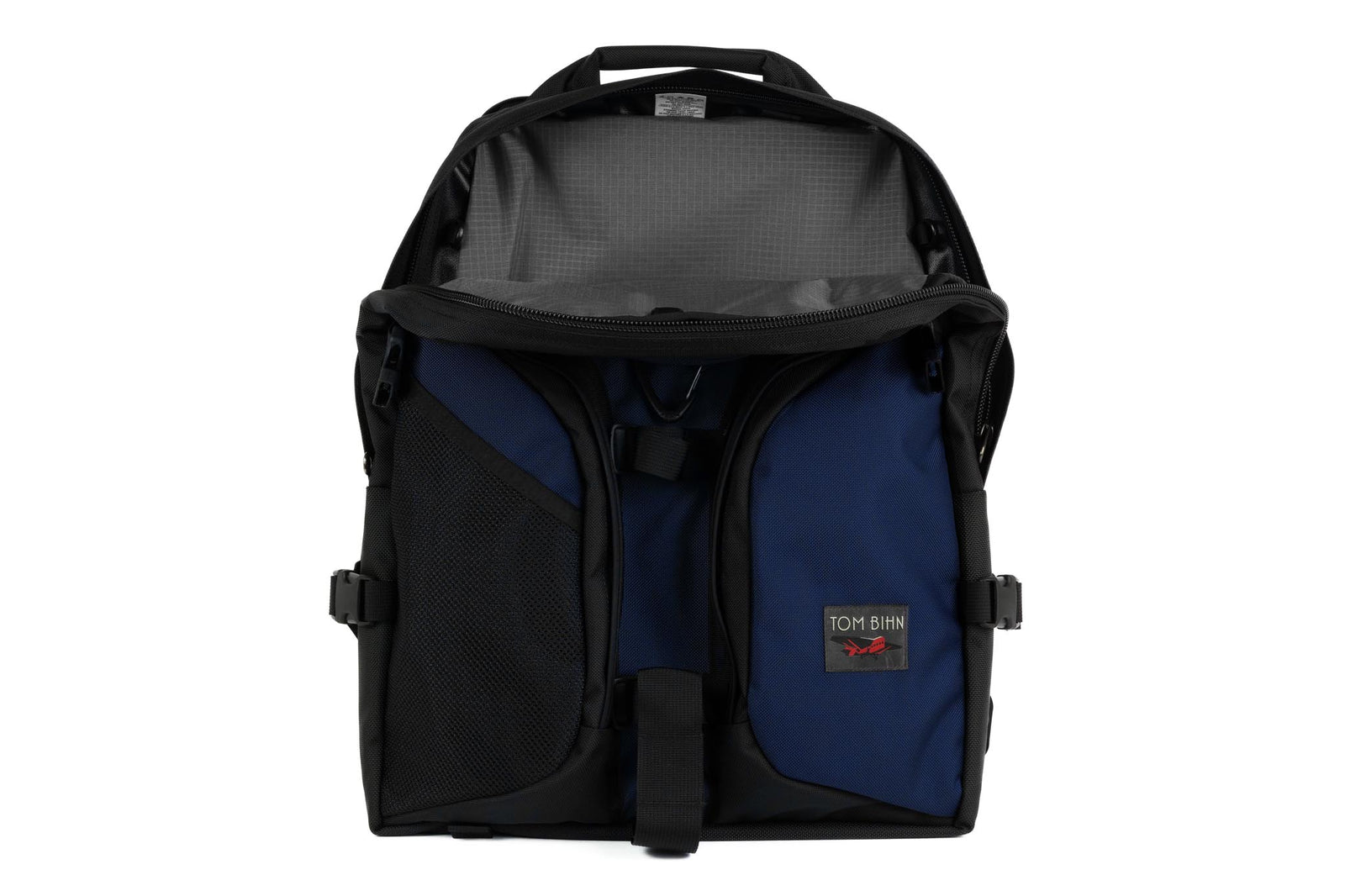 visible variant TB0114-DKGL^^The Brain Bag in Deep Blue (dark blue) 525 Ballistic with the front main compartment zipper opened to reveal its Mountain Grey (grey with light grey grid) 210 Cerylon interior.
