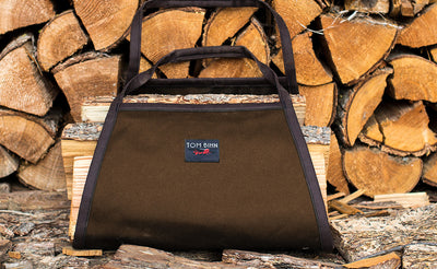 visible variant TB1444-CG^^A Firewood Carrier in Cocoa #10 Cotton holding firewood.