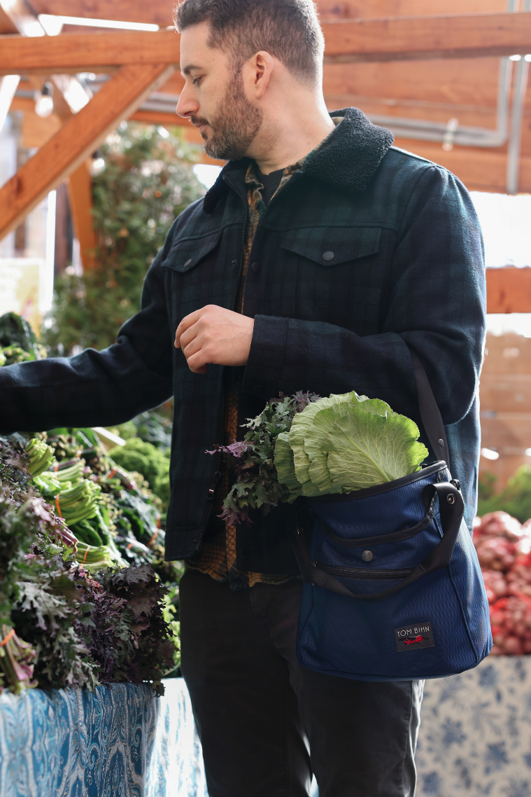 Forager in Deep Blue Ballistic/Zest halcyon filled with veggies.