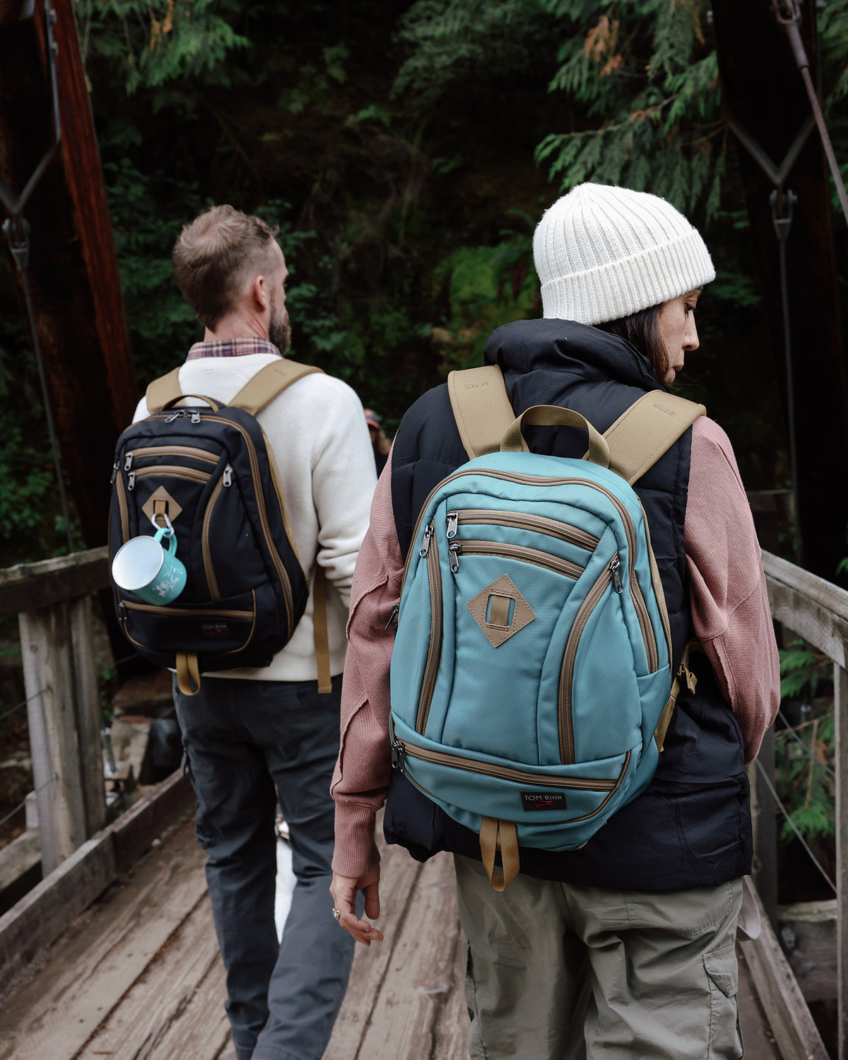 visible lifestyle^^A person carrying a GE Synapse 19 on a bridge