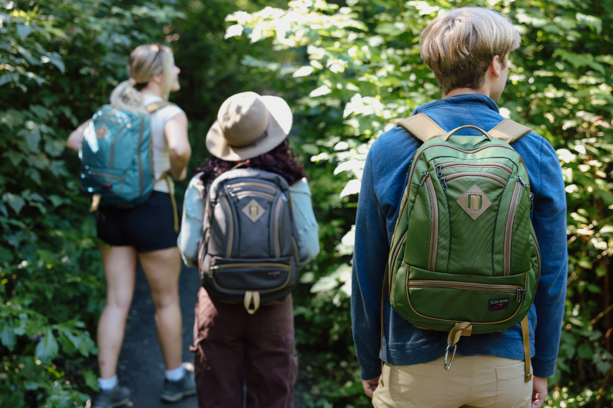 visible lifestyle^^Guide's Edition Synik 26 Saguaro person hiking through trees