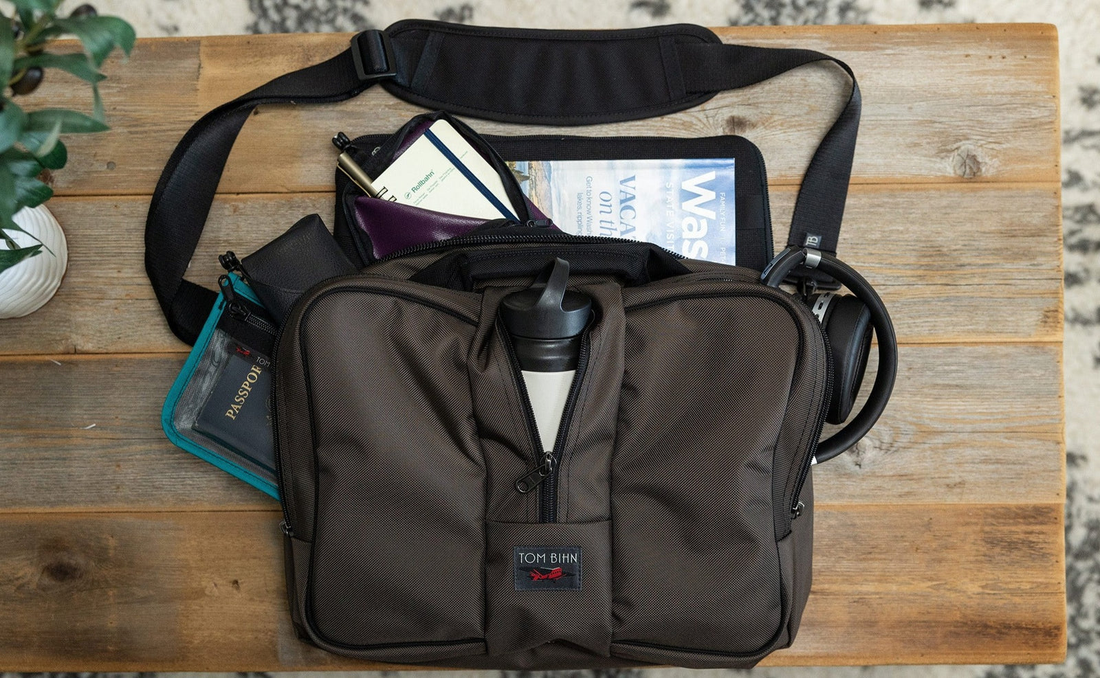 visible lifestyle^^A Co Pilot with a Passport, Water Bottle, writing kit and travel guide in it.