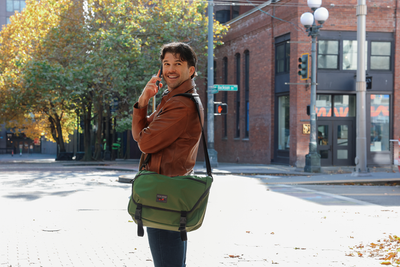 visible lifestyle^^A person holding a phone wearing the Marathon Messenger