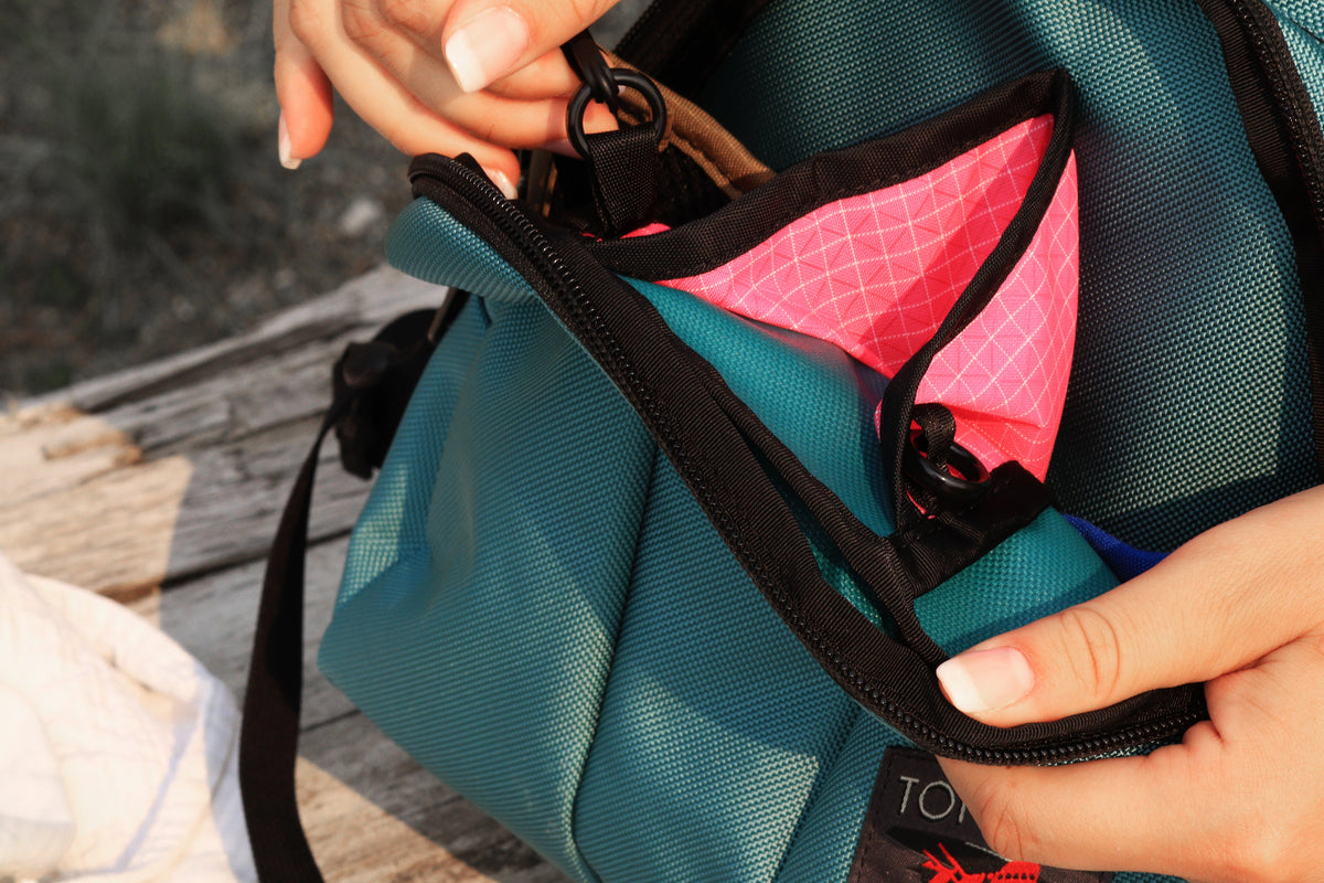 Person pulling keys from Paradigm front pocket