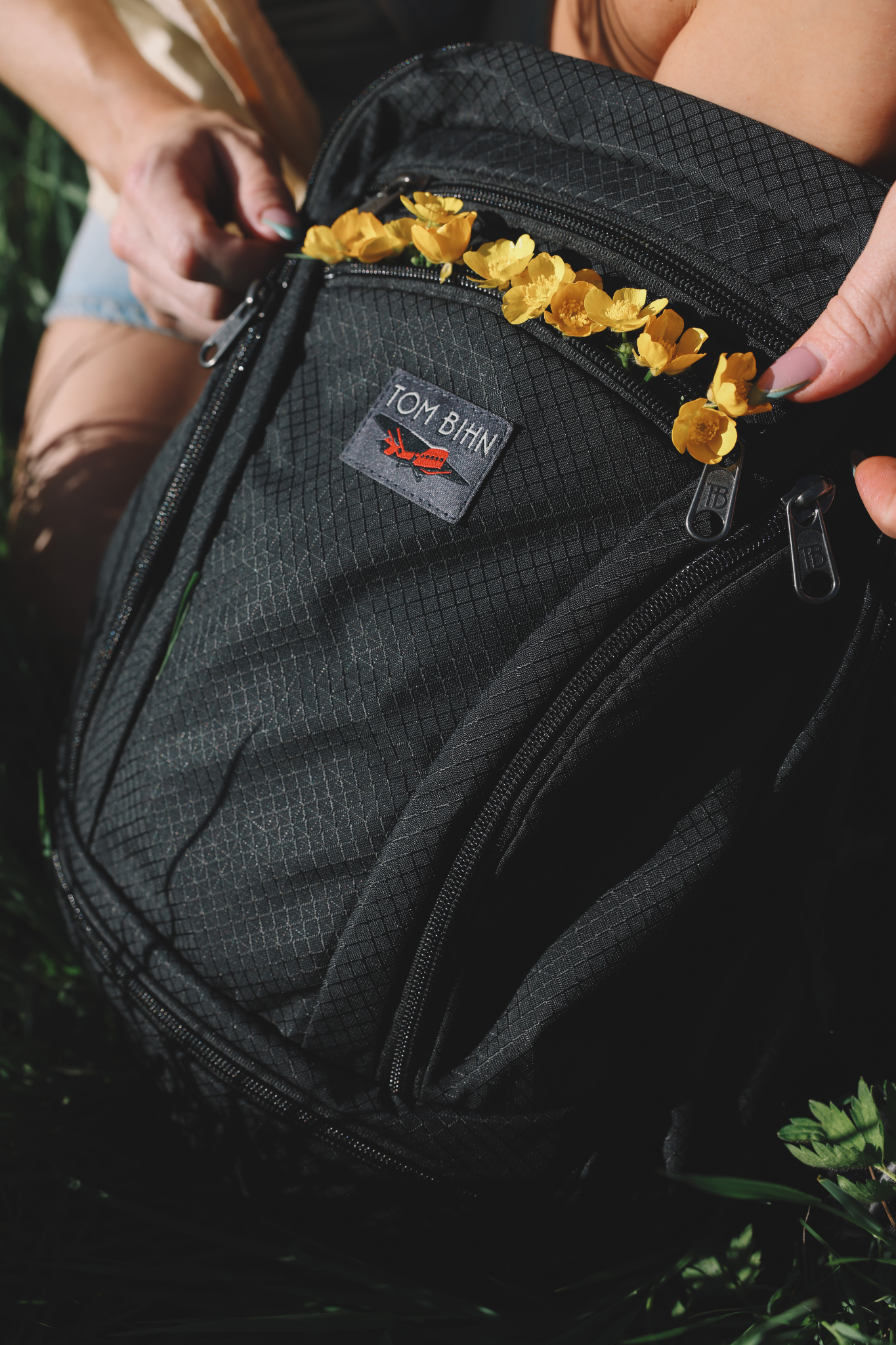 visible lifestyle^^front pocket of Synapse 19 filled with flowers.