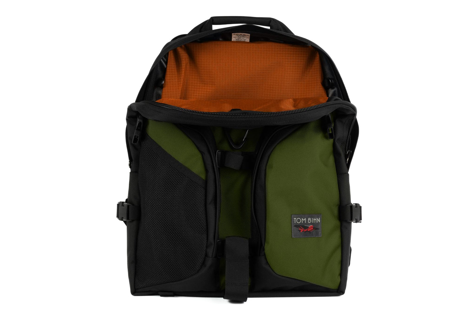 visible variant TB0114-VKPL^^The Brain Bag in Saguaro (olive green) Ballistic with the front main compartment zipper opened to reveal its Persimmon (dark orange with light orange grid) 210 Cerylon interior.