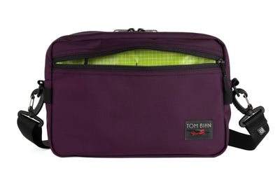 visible variant TB0415-UK1D^^The Side Hustle in Aubergine Ballistic with Kiwi (bright green with white grid) 200 Halcyon interior.