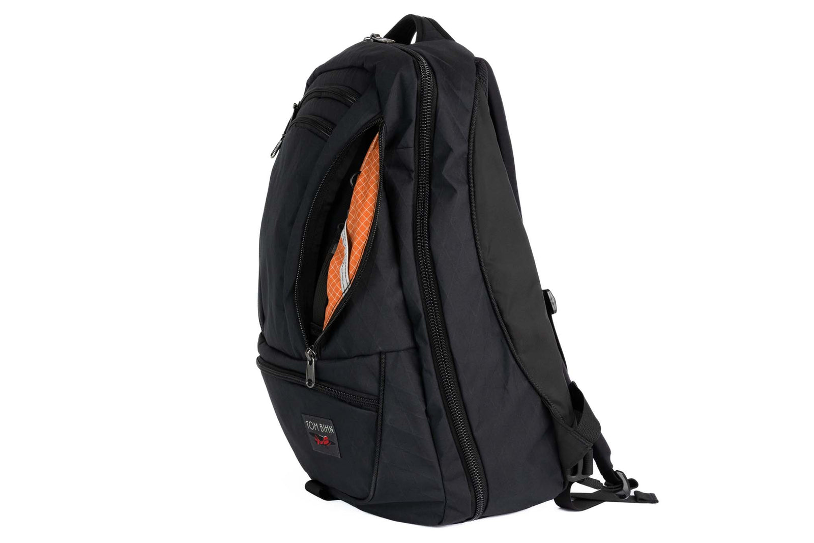 visible variant TB0121-BXZD^^Synik 30 in Black X-Pac with Zest (orange with white grid) interior.