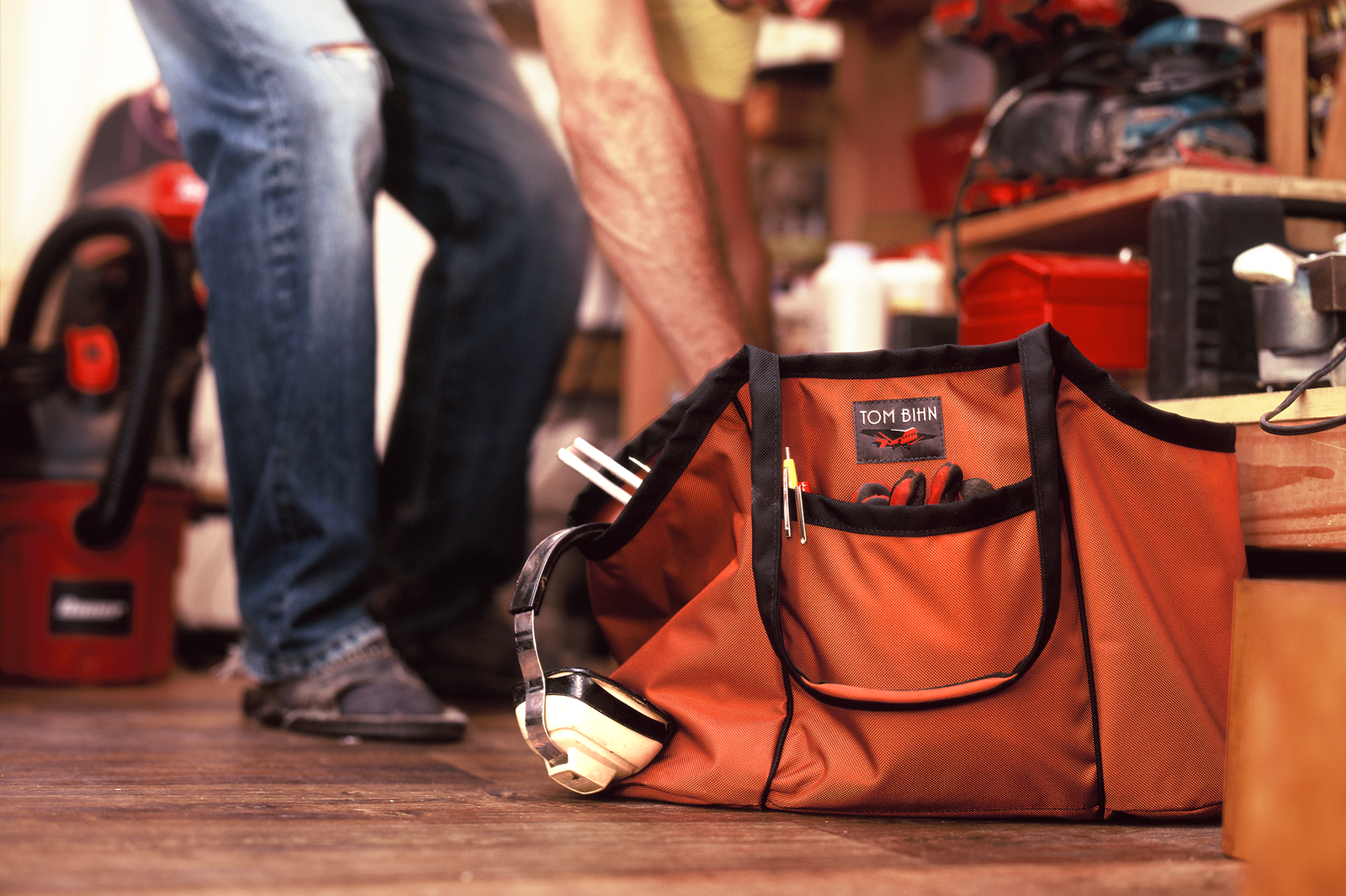 visible lifestyle^^A person loading a Truck with equipment in a workshop.