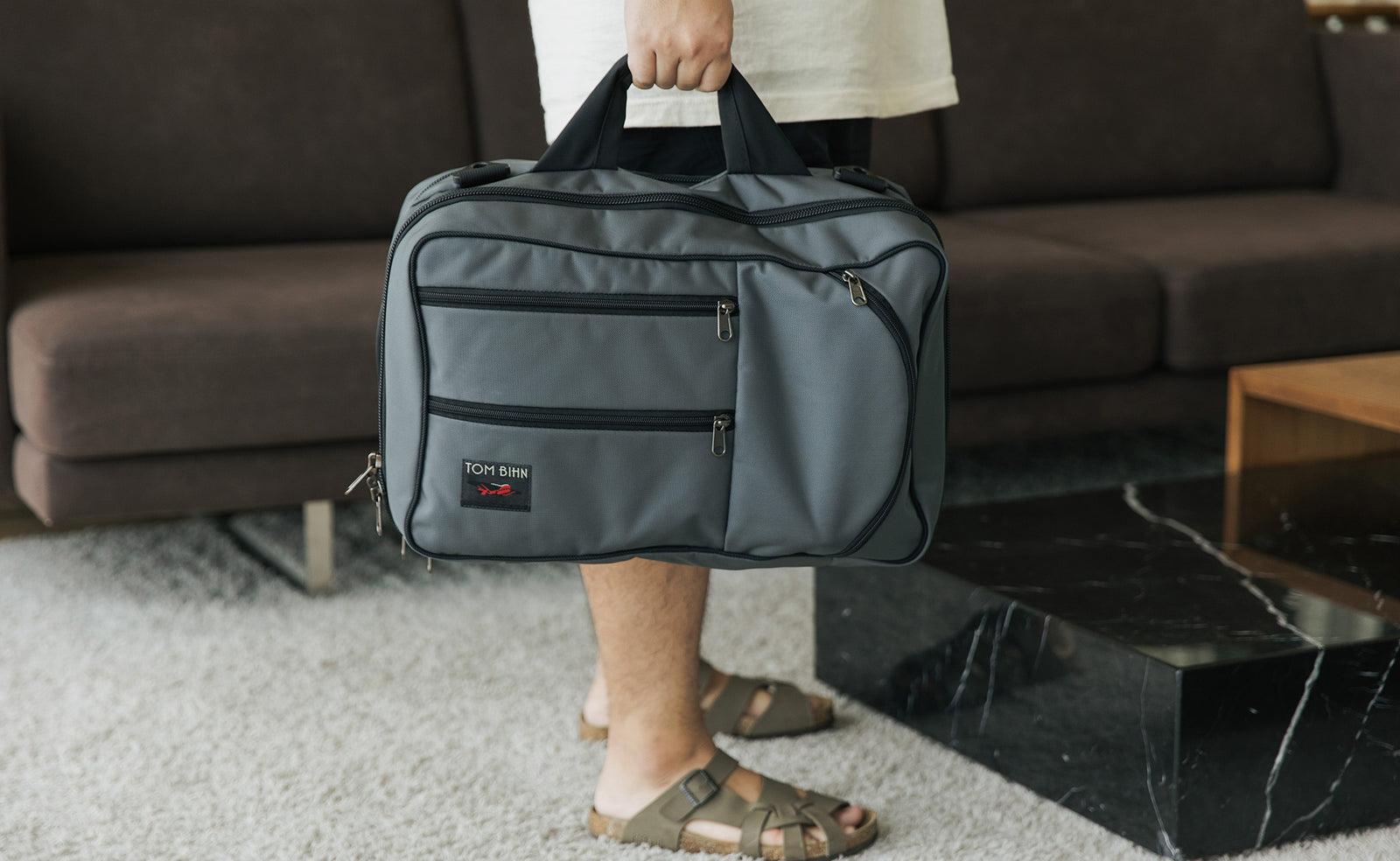 visible lifestyle^^A person holding a Western Flyer byt the main carry handle.