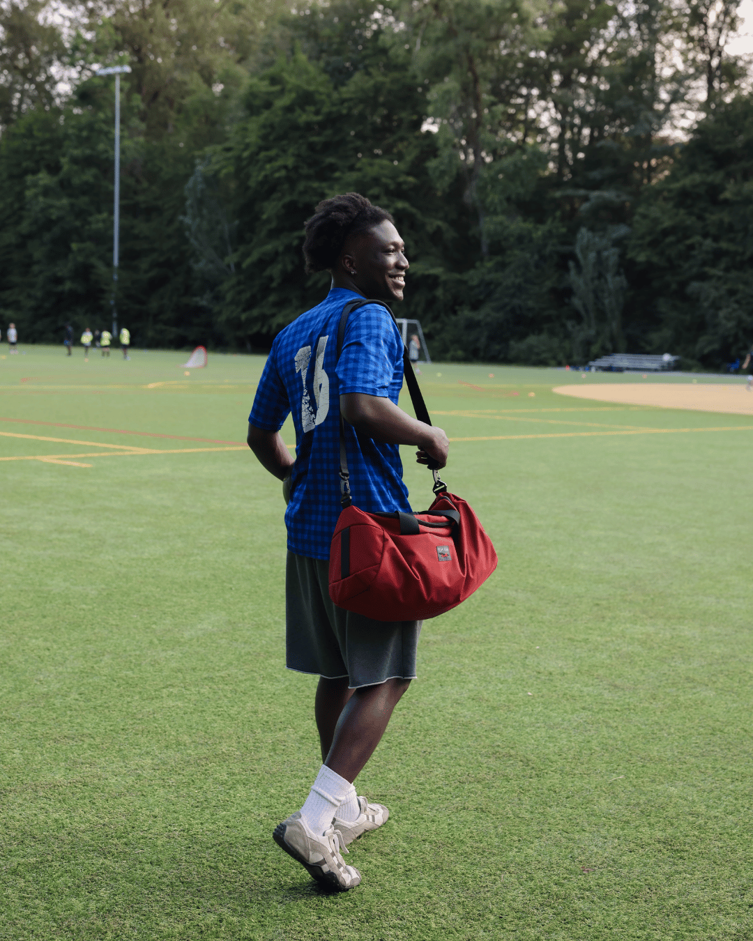 lifestyle visible^^A person shoulder carrying a Small Yeoman Duffel.