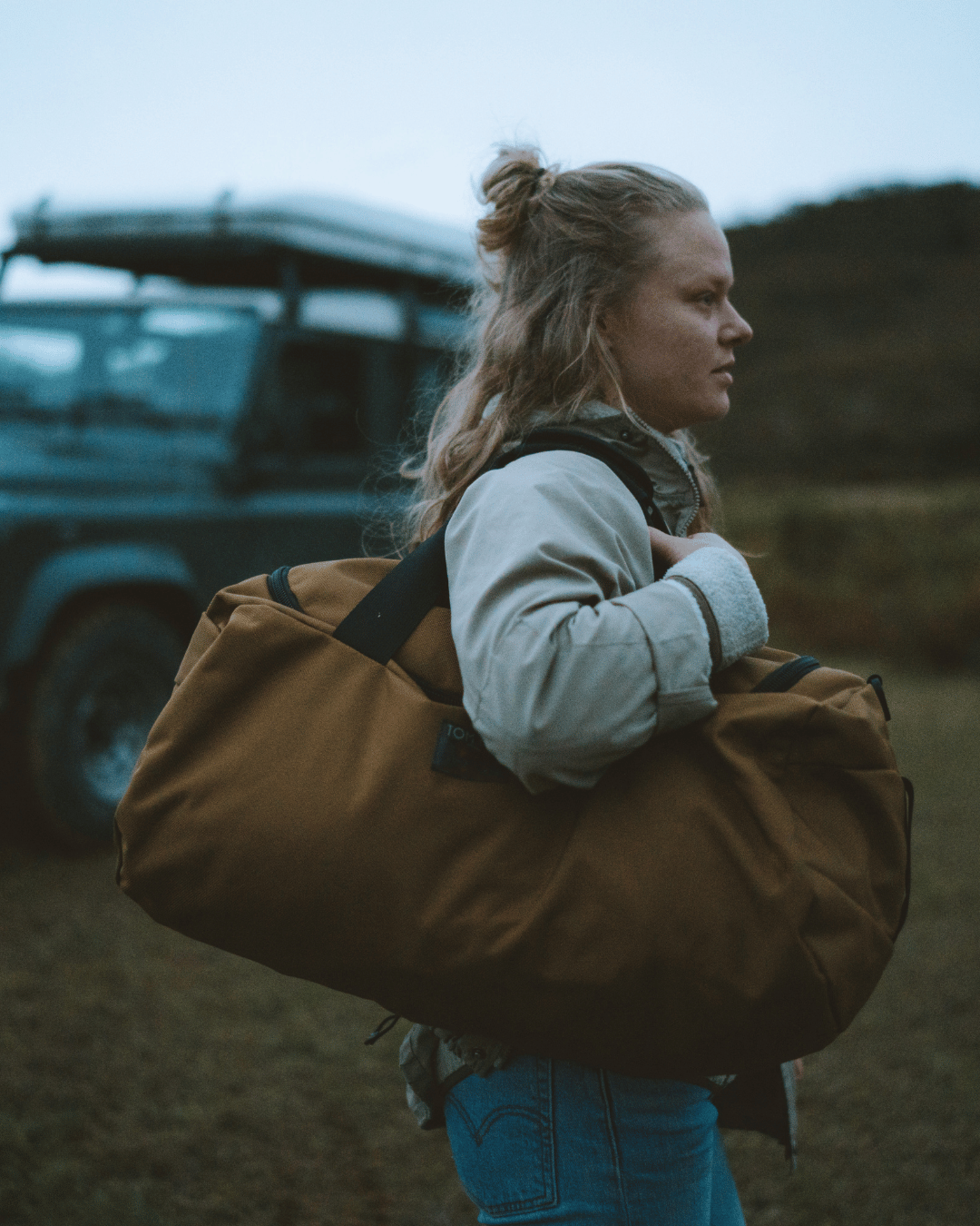 lifestyle  visible^^a Large Yeoman being carried on shoulder, duffel-style.