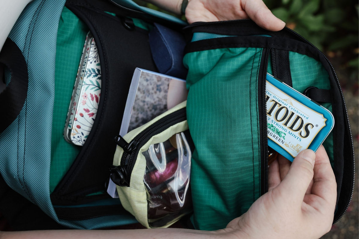 visible lifestyle^^ Person putting mints in their Zeitgeist backpack.