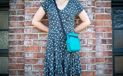 lifestyle visible^^Person wearing the Everyday Cubelet across body.