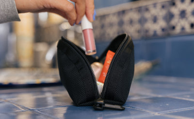 visible lifestyle^^A Small Q-Kit with lipstick and other cosmetics in it.