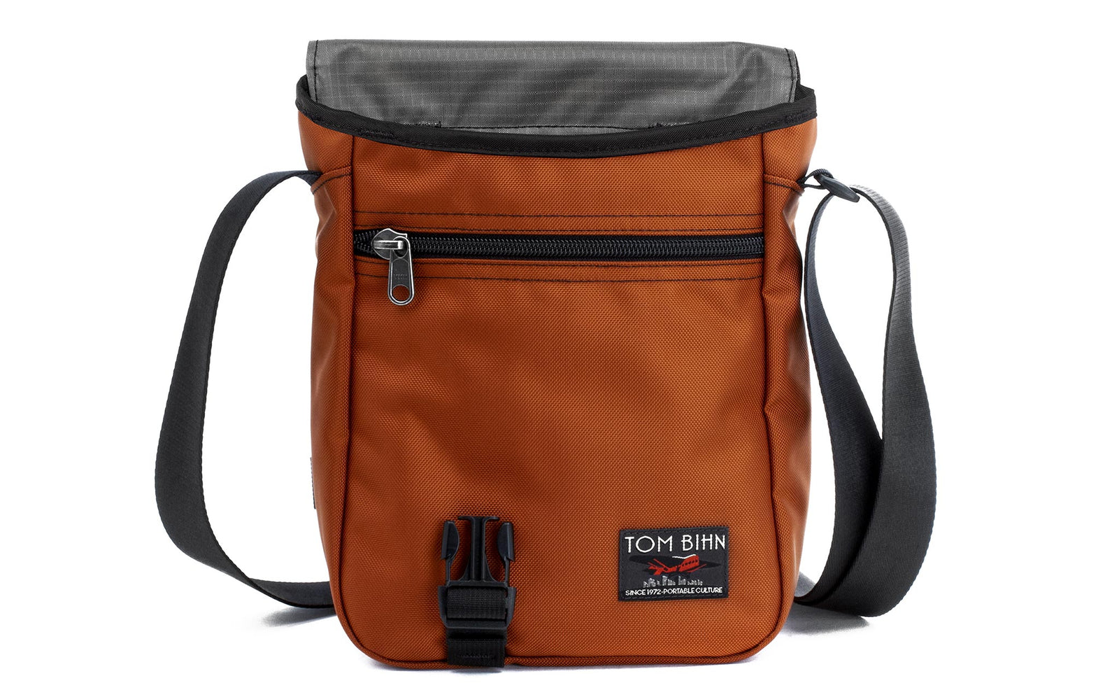 visible variant TB0201-TKGL^^A Small Cafe Bag in Burnt Orange 525 Ballistic with a Mountain Grey (grey with light grey grid) 210 Cerylon interior.