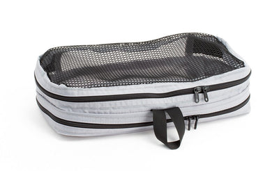 visible variant TB90501-NE^^An empty and zipped closed Northwest Sky (light grey) Aether Small Laundry Aeronaut 30 Packing Cube showing the mesh side.