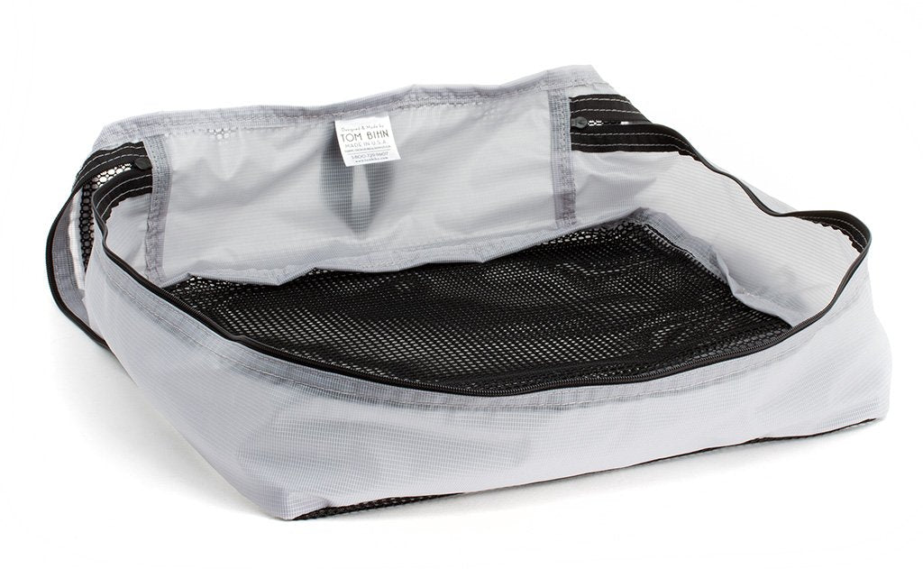 visible variant TB90604-NE^^An empty and zipped closed Northwest Sky (light grey) Aether Large Aeronaut 45 Packing Cube.
