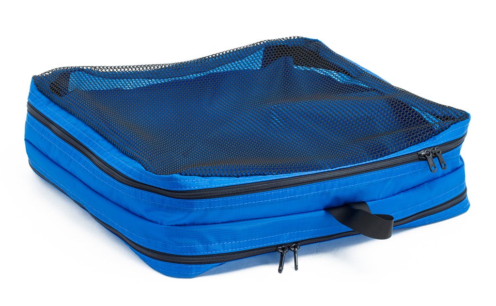 visible variant TB90605-LE^^An empty and zipped closed Island (blue) Aether Large Laundry Aeronaut 45 Packing Cube mesh side up.
