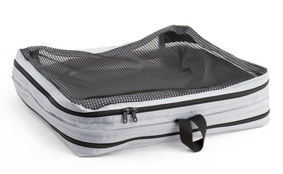 visible variant TB90605-NE^^An empty and zipped closed Northwest Sky (light grey) Aether Large Laundry Aeronaut 45 Packing Cube mesh side up.