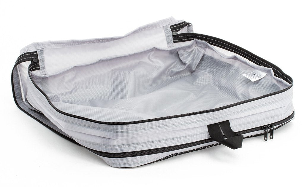 visible variant TB90605-NE^^An empty and open Northwest Sky (light grey) Aether Large Aeronaut 45 Packing Cube open all-fabric side up.