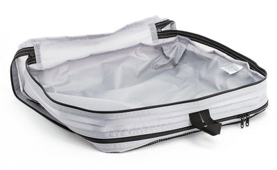 visible variant TB90605-NE^^An empty and open Northwest Sky (light grey) Aether Large Aeronaut 45 Packing Cube open all-fabric side up.