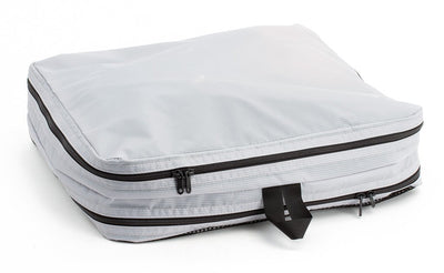 visible variant TB90605-NE^^A filled and zipped closed Northwest Sky (light grey) Aether Large Aeronaut 45 Packing Cube all-fabric side up.