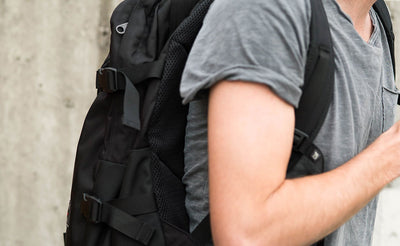 lifestyle visible^^A tight shot of the shoulder strap on a person wearing the Brain Bag.0