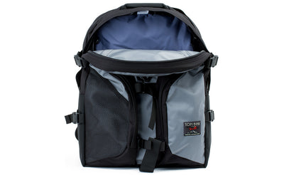 visible variant TB0104-LKDJ TB0114-LKDJ^^The Brain Bag in Cloud (light grey) 525 Ballistic with the front main compartment zipper opened to reveal its Dawn (blue-grey) 210 Ballistic interior.\