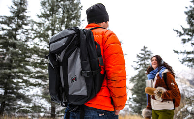 lifestyle visible^^A person hiking wearing a Brain Bag.
