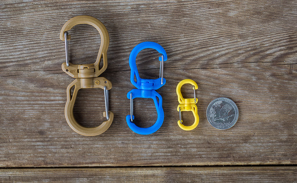 detail visible^^A comparison of the size of the Large, Medium, and Small Double Carabiners with a US quarter for size reference.