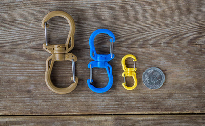 detail visible^^A comparison of the size of the Large, Medium, and Small Double Carabiners with a US quarter for size reference.