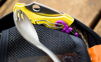 visible variant PT0573-OA PT0573-LA PT0573-UA^^A small double carabiner connecting a pocket knife to an o-ring.