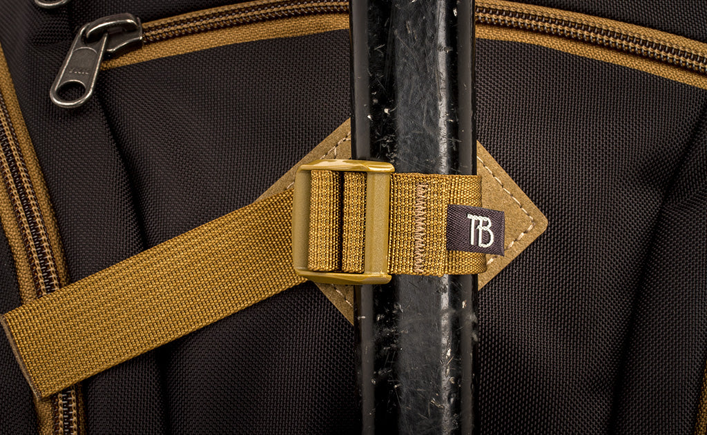 detail visible^^A close shot of an ice axe lashed in place to the lashpoint on the face of the Guide's Edtiion Synapse 25.