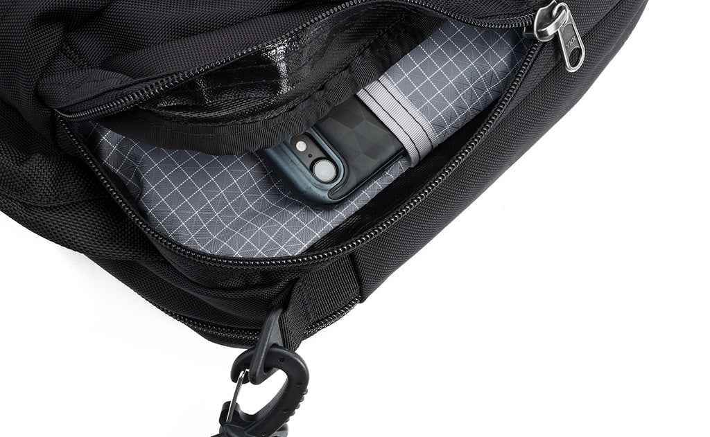 lifestyle visible^^Close-up of a phone in one of the front organizer pockets of the Co-Pilot.