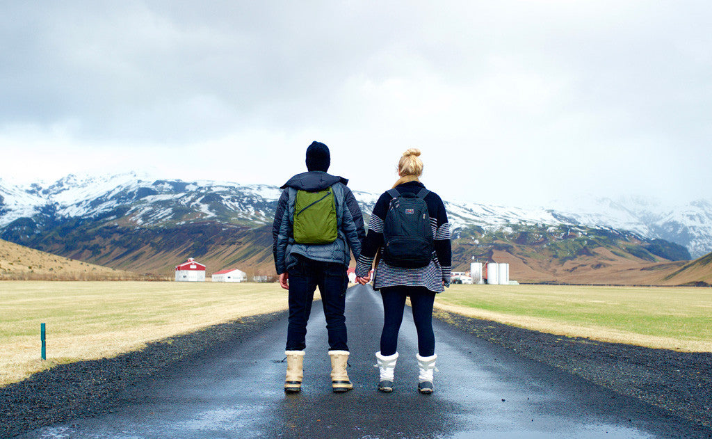 A person carrying the Daylight Backpack and another carrying a Synapse 25